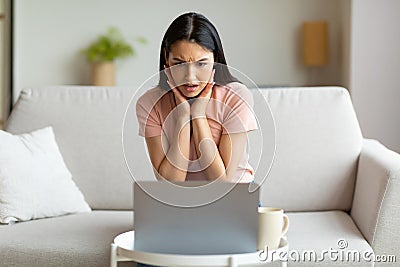 Shocked Woman At Laptop Having Bad Internet Connection At Home Stock Photo