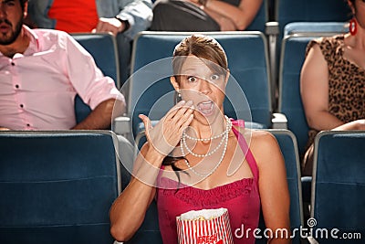 Shocked Woman with Popcorn Stock Photo