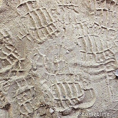 Shoe prints in loose sand. Dry soil shoeprints Stock Photo