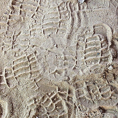 Shoe prints in loose sand. Dry soil shoeprints Stock Photo