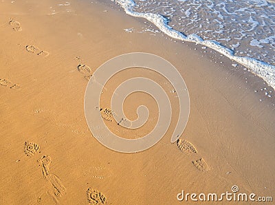 Shoe Prints at the sea Stock Photo