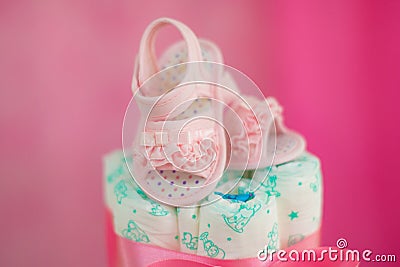 Shoe sandal detail child Close Diaper cake, baby tea with diapers decorated table Stock Photo