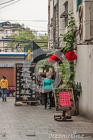 Shoe shop in alley off Zhengyang pedestrian road, Guilin, China Editorial Stock Photo