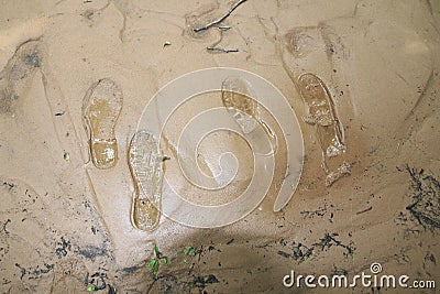Shoe tracks, impression in the sand, in the sludge, morass Stock Photo
