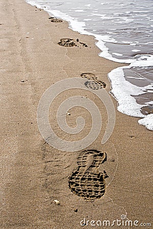 Shoeprints in the sand Stock Photo