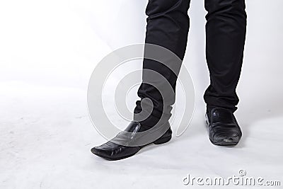 Shoes and legs of a businessman caution step Stock Photo