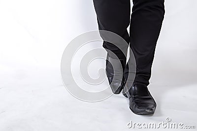 Shoes and legs of a businessman caution step Stock Photo