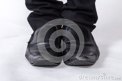 Shoes and legs of a businessman caution step Stock Photo