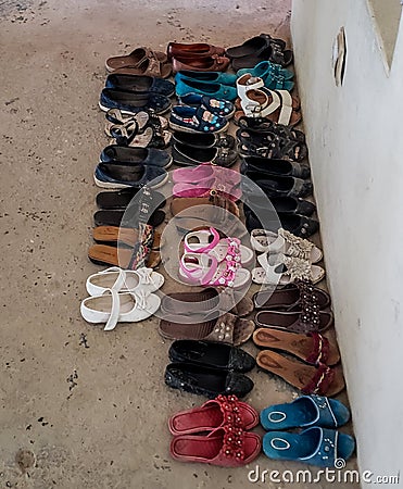 Shoes outside a mosque Stock Photo