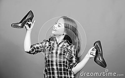 Shoes shop. Happy childhood. Glamour high heels. Awesome red stiletto shoes. Little fashionista kid with high heels Stock Photo
