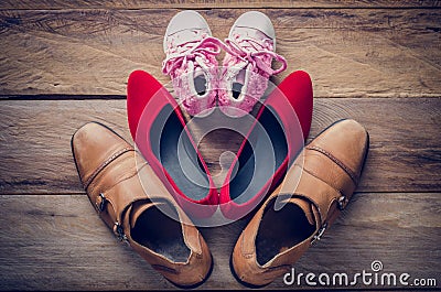 Shoes, three pairs of dad, mom, daughter - the family concept. Stock Photo