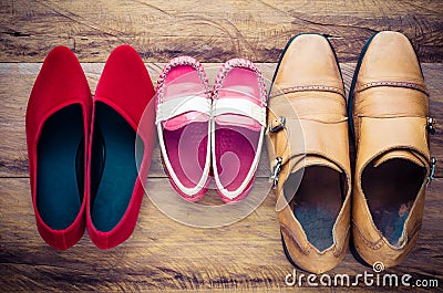 Shoes, three pairs of dad, mom, son - the family concept. Stock Photo