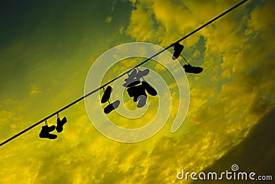 Shoes on a wire at the Prague Metronome Stock Photo