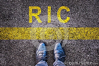 Shoes and word RIC meaning referendum at citizen`s initiative on asphalt Stock Photo