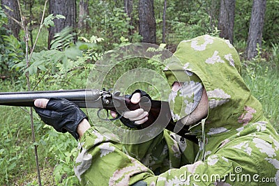 The shooter in camouflage Stock Photo