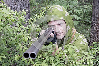 The shooter in camouflage Stock Photo