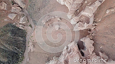 Shooting from a drone, top view of Charyn canyon. Red canyon, Martian view. Sandy and stone edge of the canyon Stock Photo