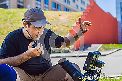 Shooting process on cinema stage - commercial production set, exterior location.Profeccional cameraman operates the Stock Photo