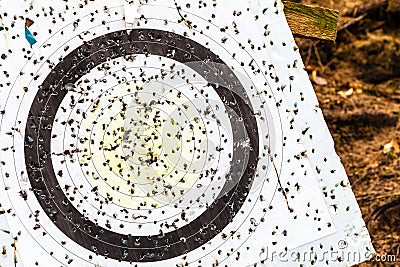 Shooting target and bullseye with many bullet holes Stock Photo