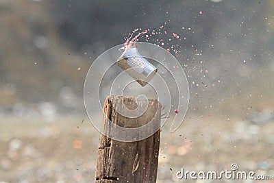 Shooting tin cans Stock Photo