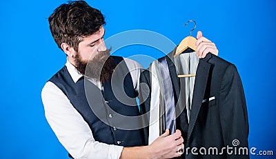 Shop assistant or personal stylist service. Matching necktie with outfit. Man bearded hipster hold neckties and formal Stock Photo