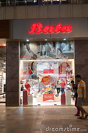 Shop exterior of a bata store in a busy shopping mall at night Editorial Stock Photo
