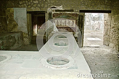 Shop selling food in the central street of Pompeii. Naples Editorial Stock Photo