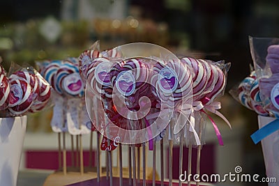 A shop window with colorful lollipops on a stick. Editorial Stock Photo