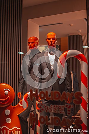 Shop windows. Boutique display. Fashion Store exterior. City Night Boutique. Front View from street outdoor. LED light Editorial Stock Photo