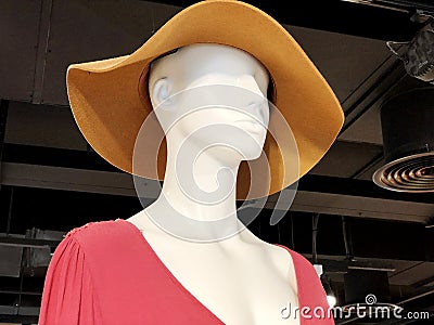 Shop women`s clothing. Mannequin in modern stylish clothes. Mannequin in a bonnet Stock Photo