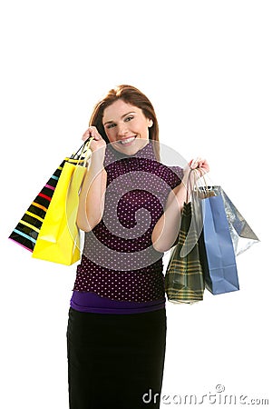 Shopaholic woman with colorful bags over white Stock Photo