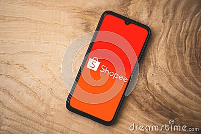 Shopee application on smartphone. Top angle shot. Shopee a Singaporean multinational technology company which focuses on e- Editorial Stock Photo