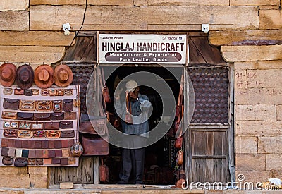 Shopkeeper opens his leather accessories store in the morning at the Golden Fort Editorial Stock Photo