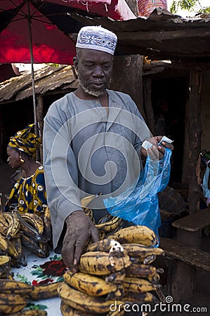 Shopkeeper selling plantain in Bamako Editorial Stock Photo