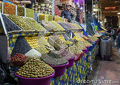 Shopkeeper selling world famous Moroccan olives in the Medina Souk in Meknes, Morocco. Editorial Stock Photo