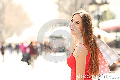 Shopper woman shopping in the street in summer Stock Photo