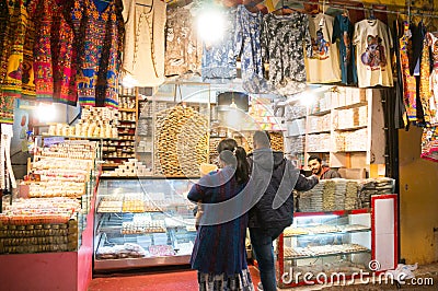 shoppers browsing the colorful night market in dwarka gujarat Editorial Stock Photo