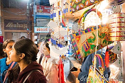 shoppers browsing the colorful night market in dwarka gujarat Editorial Stock Photo