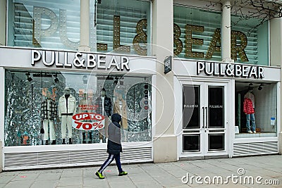 Shoppers wearing face masks outside Pull&Bear flagship store, Oxford Street London Editorial Stock Photo