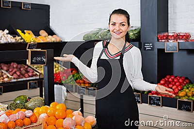 Shopping assistant demonstrating assortment of grocery shop Stock Photo