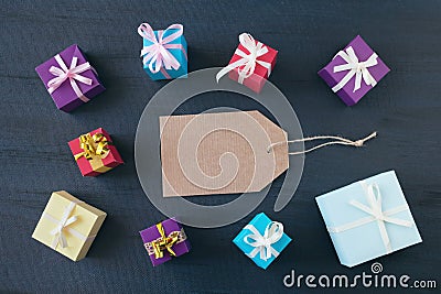 Shopping banner mockup with cardboard label and gift boxes on dark background Stock Photo