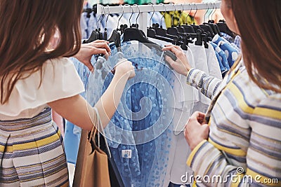 Shopping with bestie. two women shopping in retail store. Close up view Stock Photo