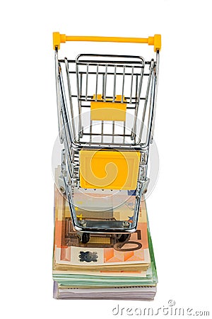 Shopping cart on bills Stock Photo