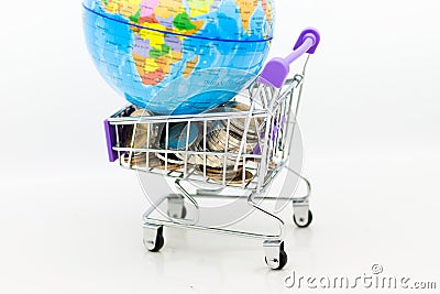Shopping cart with coins for retail business. Image use for online and offline shopping, marketing place world wide, business Stock Photo