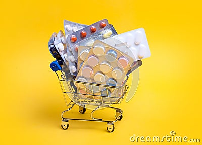 Shopping cart with different tablets and pills Stock Photo