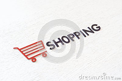 a shopping cart icon concept cut out letters, sale store business, simple minimalistic Stock Photo