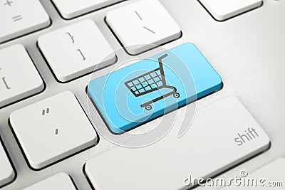 Shopping cart symbol on blue button key of white keyboard, online shopping Stock Photo