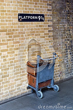 Shopping cart in the wall at platform 9 three-quarter Editorial Stock Photo