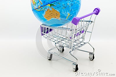 Shopping cart with world map for retail business. Image use for online and offline shopping, marketing place world wide, business Stock Photo
