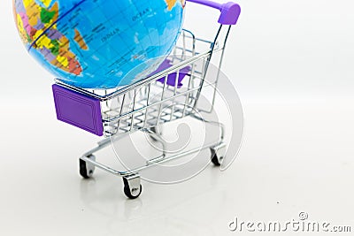 Shopping cart with world map for retail business. Image use for online and offline shopping, marketing place world wide, business Stock Photo